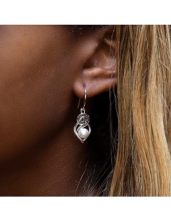 Rhodiumbelagte Kærlighedsknude Øreringe
med Sort Cubic Zirconia og Hvid Perle